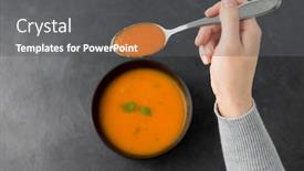  Presentation with soup - PPT theme enhanced with food eating and new nordic cuisine concept - close up of hands with bowl of pumpkin cream soup and spoon on stone table background and a gray colored foreground