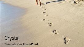  Presentation with footprints sand - Amazing PPT theme having footprints in wet sand backdrop and a mint green colored foreground