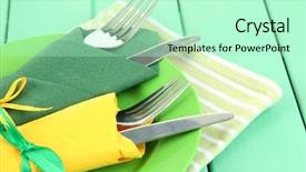  Presentation with napkins - Theme enhanced with forks and knives wrapped in green and yellow paper napkins on color wooden background background and a mint green colored foreground