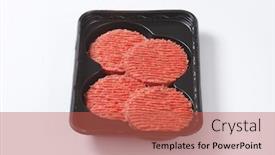  Presentation with hamburger - Amazing PPT theme having four raw hamburger patties on black plastic tray backdrop and a red colored foreground