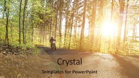  Presentation with forest road - PPT theme with man seat on the motorcycle on the forest road during sunrise background and a coral colored foreground