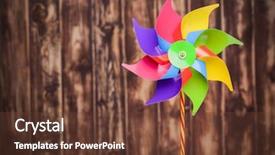  Presentation with pinwheel - Amazing theme having free wind turbine - colorful pinwheel on wooden background backdrop and a tawny brown colored foreground