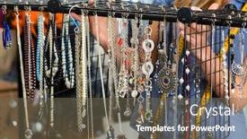  Presentation with jewelry - PPT theme with freelance - jewelry designer working on a draft different pieces of jewelry hanging in front background and a tawny brown colored foreground