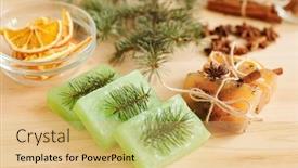  Presentation with glassware - PPT theme featuring fresh handmade soap bars scented by conifer and aromatic spices and glassware with orange slices on wooden table background and a yellow colored foreground