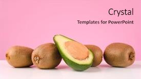  Presentation with fresh avocado - Colorful slide deck enhanced with fresh kiwi and sliced avocado on a table isolated on pink background backdrop and a light gray colored foreground