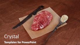  Presentation with table salt - Amazing theme having fresh raw beef rib eye steak on walnut table with salt spice and black iron antique forged cutlery fork knife backdrop and a tawny brown colored foreground