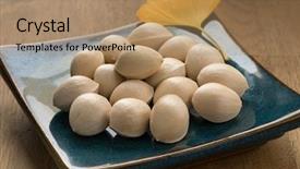  Presentation with ginkgo - Audience pleasing slide set consisting of fresh raw ginkgo biloba nuts backdrop and a coral colored foreground