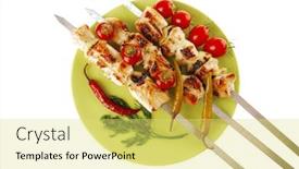  Presentation with kebab - Presentation having fresh roast shish kebab on green platter with vegetables background and a yellow colored foreground