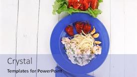  Presentation with blue rose - Theme with fresh rose wild salmon baked in cream cheese sauce with italian pasta and red hot pepper on blue plate over white wooden table with vegetable salad background and a teal colored foreground