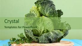  Presentation with cabbage - Cool new theme with fresh savoy cabbage on blue wooden table on yellow background backdrop and a seafoam green colored foreground