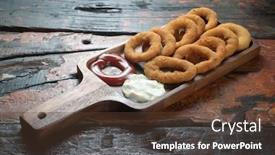  Presentation with mayonnaise - PPT theme having fried onion rings with ketchup and mayonnaise isolated on rustic wooden table background and a tawny brown colored foreground