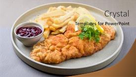  Presentation with veal - Slide set featuring fried wiener schnitzel from veal topside with french fries and cranberry sauce as closeup modern design plate background and a lemonade colored foreground