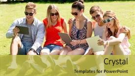  Presentation with computers - Audience pleasing theme consisting of friendship leisure summer technology and people concept - group of smiling friends with tablet pc computers sitting on grass in park backdrop and a yellow colored foreground