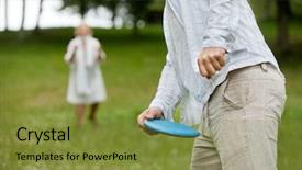  Presentation with man woman - Amazing slide set having midsection of man in casual wear ready to throw flying disc with woman in background backdrop and a gold colored foreground