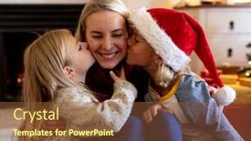  Presentation with young children - Slide set consisting of front view close up of a young caucasian woman sitting on the floor between her young son and daughter in their sitting room at christmas time the children kissing her on either cheek background and a tawny brown colored foreground