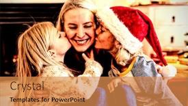  Presentation with young children - Colorful presentation theme enhanced with front view close up of a young caucasian woman sitting on the floor between her young son and daughter in their sitting room at christmas time the children kissing her on either cheek backdrop and a gold colored foreground