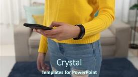  Presentation with standing sitting - Beautiful PPT theme featuring front view mid section of a young caucasian woman using a smartphone standing in her sitting room backdrop and a ocean colored foreground