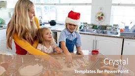  Presentation with gingerbread man - Beautiful slide set featuring front view of a happy young caucasian mother with her young daughter and son in their kitchen at christmas time making cookies cutting shapes from dough with cooked gingerbread man cookies backdrop and a coral colored foreground
