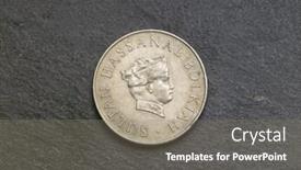  Presentation with slate - Amazing PPT theme having front view of coin on the black slate backdrop and a gray colored foreground