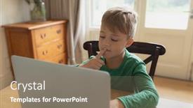  Presentation with dining table - Audience pleasing slide deck consisting of front view of cute caucasian boy using laptop at dining table in a comfortable home backdrop and a gray colored foreground