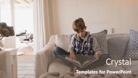  Presentation with story book - Amazing PPT theme having front-view-of-young-boy backdrop and a gray colored foreground