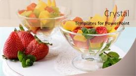  Presentation with glassware - Colorful theme enhanced with fruit salad with mint in glassware on wooden table and planks background backdrop and a yellow colored foreground
