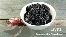  Presentation with tea leaves fresh green leaf - Presentation enhanced with fruits plums - saucer of prunes with leaves background and a gray colored foreground