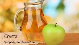  Presentation with juice - Presentation theme with full jug of apple juice and apple on wooden table on bright background background and a yellow colored foreground