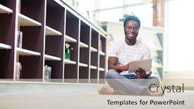  Presentation with digital library - Presentation design with full length portrait of smiling male student using digital tablet while sitting on floor at library background and a soft green colored foreground