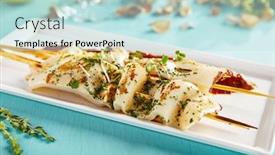  Presentation with hot sauce - Beautiful theme featuring gastronomic restaurant menu hot appetizer - squid with spicy sauce sprinkled with seasonings and greens served on plate on wooden sticks on blue wooden table backdrop and a sky blue colored foreground