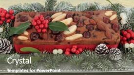  Presentation with gold silver - Beautiful presentation theme featuring genoa cake with holly mistletoe and winter greenery on a silver plate over gold tablecloth background backdrop and a gray colored foreground