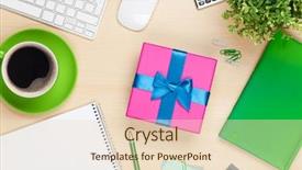  Presentation with gift - PPT theme enhanced with happy young couple smiling while shopping online on new year s eve sitting on sofa using credit card and laptop girl holding gift box in hands background and a dark gray colored foreground.