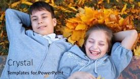  Presentation with bright yellow - Audience pleasing PPT theme consisting of girl and boy teenager having holiday in autumn city park lying on grass posing smiling playing and having fun bright yellow trees and leaves backdrop and a light blue colored foreground