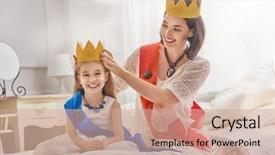  Presentation with queen - Presentation having happy loving family is preparing for a costume party mother and her child girl playing together beautiful queen and princess in gold crowns background and a coral colored foreground