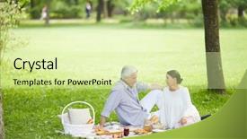  Presentation with picnic - Slides enhanced with glades - mature couple sitting on green background and a soft green colored foreground