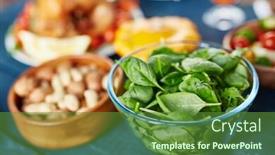  Presentation with feast - Theme enhanced with glass bowl filled with fresh bright green basil leaves standing on rustic wooden table next to smaller bowl of nuts at family feast background and a tawny brown colored foreground