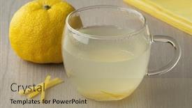 Presentation with tea cup - Slide set consisting of glass cup with fresh japanese yuzu tea and a whole yuzu in the background background and a coral colored foreground