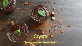  Presentation with chocolate dessert - Theme having glass cups of chocolate dessert with fresh mint and hazelnuts on black wooden table background and a tawny brown colored foreground