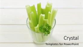  Presentation with celery - Presentation theme featuring glass of green celery stems on white wooden background background and a soft green colored foreground