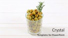  Presentation with green glass - Slide deck featuring glass of green olives stuffed with red pepper on white background background and a soft green colored foreground