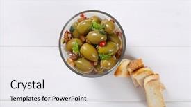  Presentation with green glass - Amazing PPT layouts having glass of marinated green olives with toasts on white wooden background backdrop and a white colored foreground