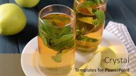  Presentation with mint - Audience pleasing PPT theme consisting of glasses of apple juice with fruits and fresh mint on table close up backdrop and a yellow colored foreground