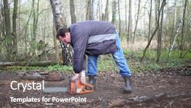  Presentation with chainsaw - Amazing PPT layouts having man with glasses starts a chainsaw in the forest backdrop and a gray colored foreground
