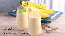  Presentation with smoothie - Audience pleasing PPT theme consisting of glasses with delicious banana smoothie on wooden table backdrop and a coral colored foreground