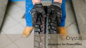  Presentation with technical service - Presentation theme enhanced with gloved hands of contemporary technical service worker moving new tyre forwards while going to replace it background and a coral colored foreground