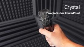  Presentation with acoustic - Amazing presentation theme having golden-microphone-in-hand-gray backdrop and a dark gray colored foreground