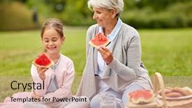  Presentation with family - Theme having granddaughter eating watermelon on picnic background and a soft green colored foreground