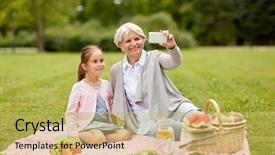  Presentation with technology - PPT layouts consisting of grandmother and granddaughter having picnic background and a  colored foreground