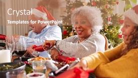  Presentation with cracker - Beautiful slide set featuring grandmother pulling christmas cracker with granddaughter as they sit for meal at table backdrop and a coral colored foreground