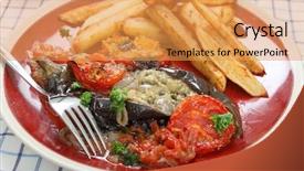  Presentation with eggplant - Presentation enhanced with greek and turkish speciality imam baildi eggplant baked in olive oil with onion tomato garlic parsley topped with bread crumbs served with potato chips or french fries background and a yellow colored foreground